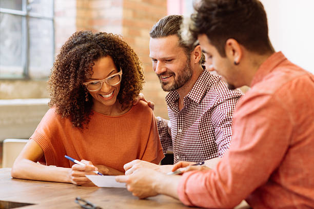 Smiling couple with mortgage agent